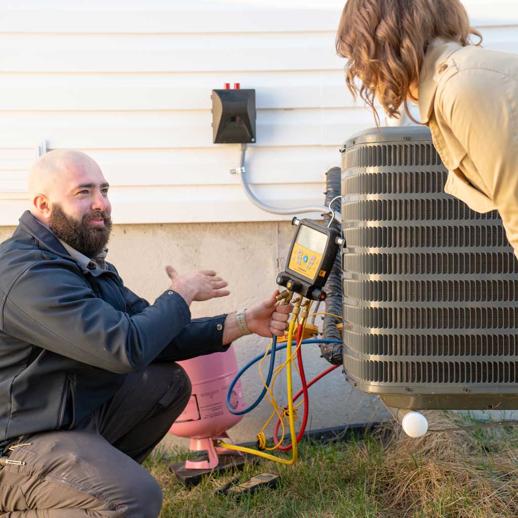 HVAC Maintenance | Five Star Home Services tech with homeowner
