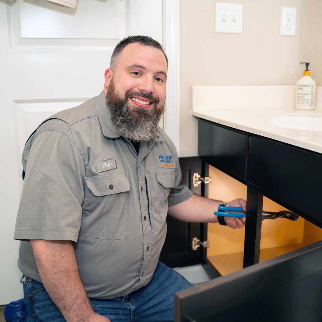 Plumbing Repair | Five Star Home Services tech repairing sink