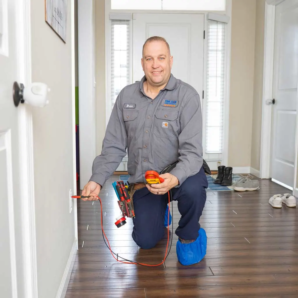 technician checking electrical outlet