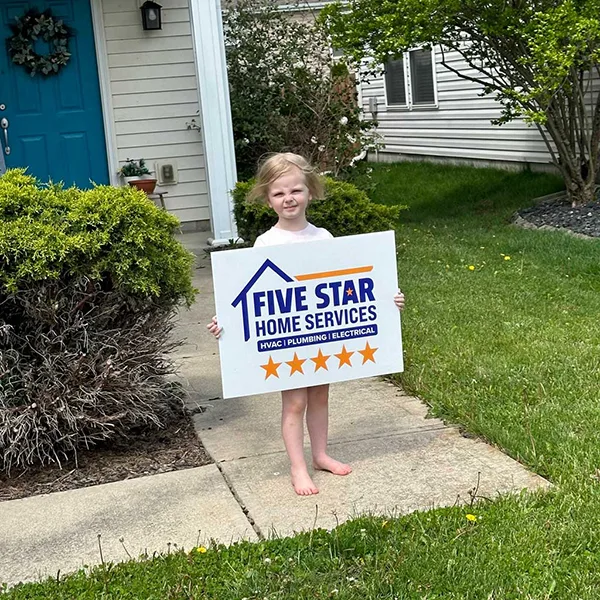 kid with yard sign